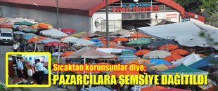 PAZARCILARA ŞEMSİYE DAĞITILDI..